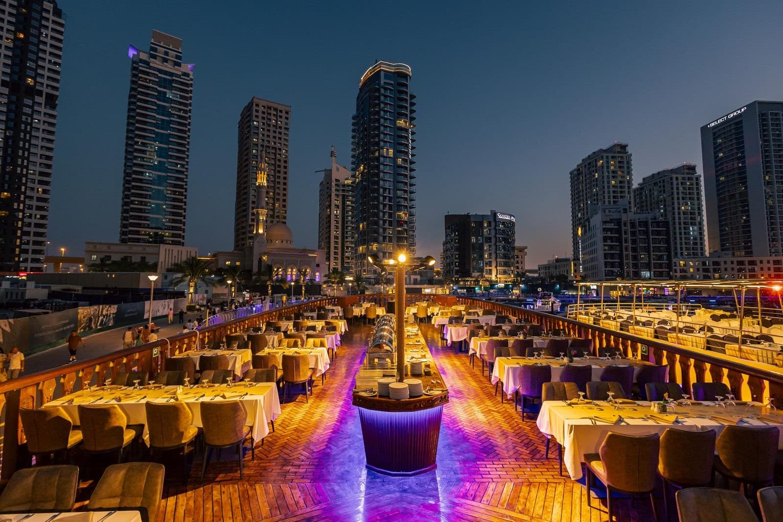 Upper deck of Alexandra 2 dhow cruise with panoramic Dubai Marina views